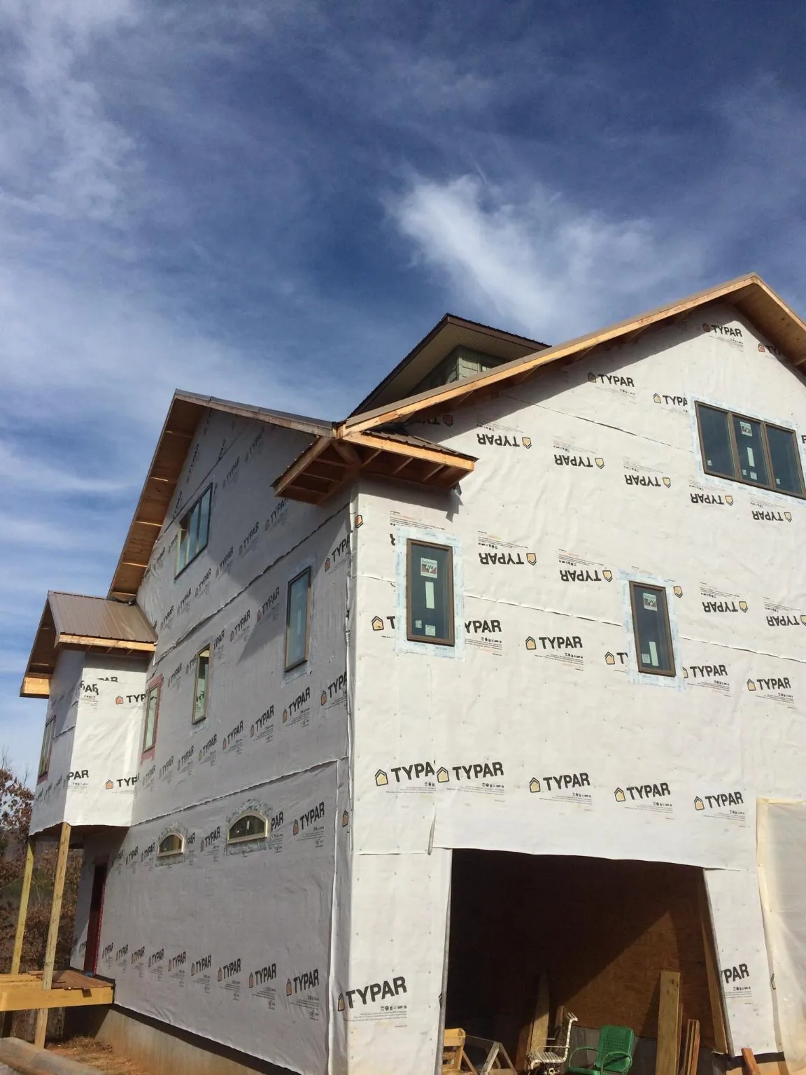 Stick built house wrapped in Typar with new roof framing and dormers in Monticello